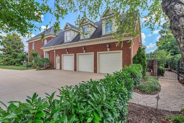 1512 Mirabella Way, Murfreesboro, TN 37130 - view of side of property featuring driveway, brick siding, a gate, and a shingled roof
