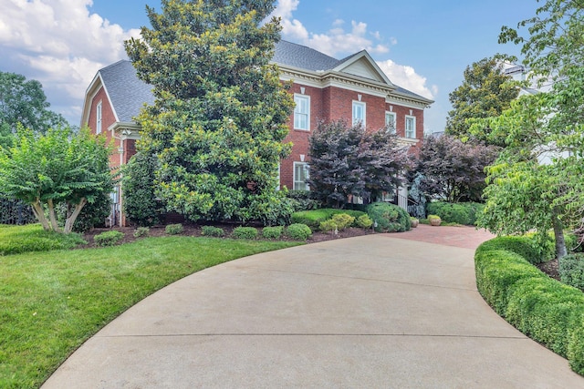 1512 Mirabella Way, Murfreesboro, TN 37130 - view of front of property with brick siding, a shingled roof, and a front lawn