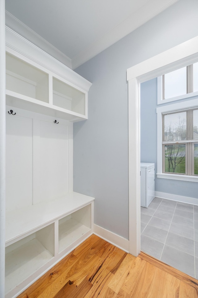 822 Manner Ln, Lebanon, TN 37087 - mudroom featuring independent washer and dryer, ornamental molding, and wood finished floors
