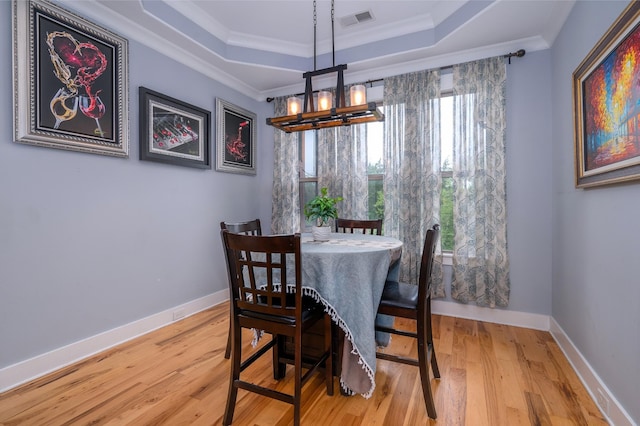 822 Manner Ln, Lebanon, TN 37087 - dining area with a chandelier, a raised ceiling, wood finished floors, and ornamental molding
