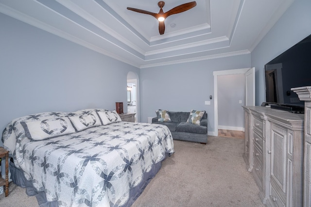 822 Manner Ln, Lebanon, TN 37087 - bedroom featuring light carpet, a tray ceiling, arched walkways, a ceiling fan, and crown molding