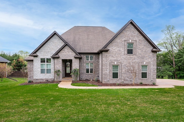822 Manner Ln, Lebanon, TN 37087 - french country style house featuring a front lawn, brick siding, and roof with shingles