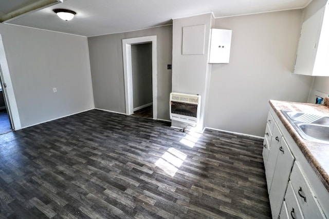 289 Long St W, Mc Ewen, TN 37101 - kitchen featuring heating unit, dark wood-type flooring, white cabinets, and light countertops