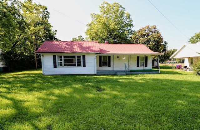 289 Long St W, Mc Ewen, TN 37101 - view of front of house with a front lawn, a porch, and a metal roof