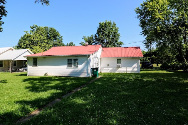 289 Long St W, Mc Ewen, TN 37101 - back of property featuring a lawn and a metal roof