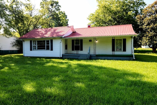 289 Long St W, Mc Ewen, TN 37101 - view of front of home featuring a porch, a metal roof, and a front yard