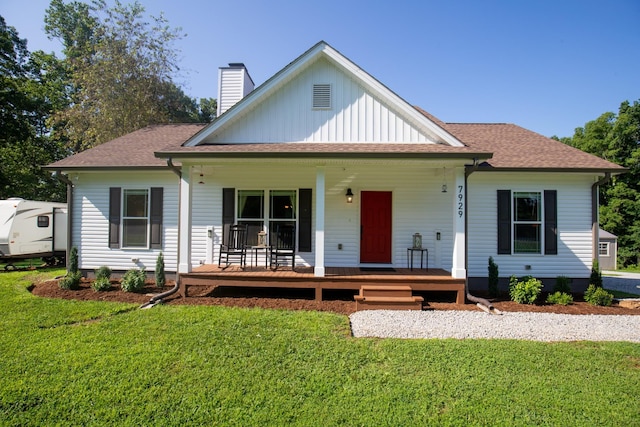 7929 Ridgewood Rd, Goodlettsville, TN 37072 - view of front of property featuring a chimney, a front yard, a porch, and roof with shingles