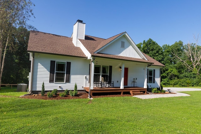 7929 Ridgewood Rd, Goodlettsville, TN 37072 - rear view of property with a chimney, a lawn, a shingled roof, and covered porch