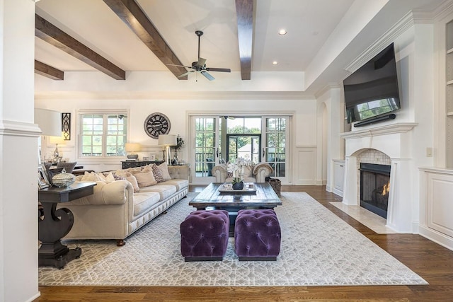 7216 Wildings Blvd, College Grove, TN 37046 - living room featuring ceiling fan, a decorative wall, a fireplace with flush hearth, healthy amount of natural light, and wood finished floors