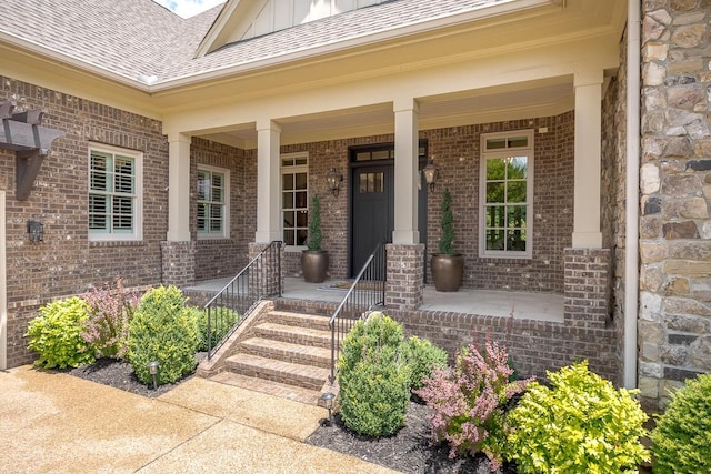 7216 Wildings Blvd, College Grove, TN 37046 - property entrance with board and batten siding, brick siding, a porch, and roof with shingles