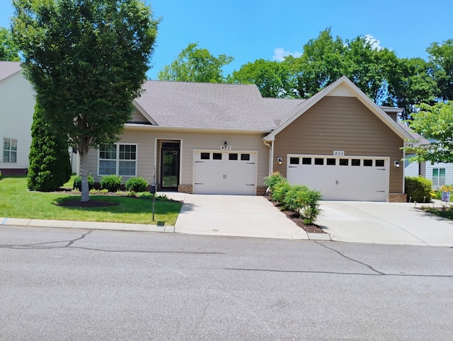 433 Bruce Dr, Spring Hill, TN 37174 - view of front facade featuring concrete driveway, a front lawn, and an attached garage