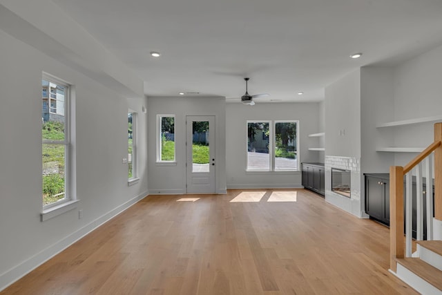 1117 38th Ave N Unit B, Nashville, TN 37209 - unfurnished living room featuring stairs, plenty of natural light, light wood-style floors, and recessed lighting