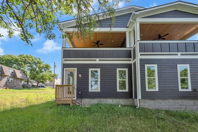 1117 38th Ave N Unit B, Nashville, TN 37209 - rear view of house with ceiling fan, a balcony, a lawn, and a standing seam roof