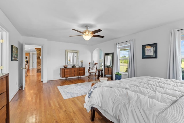3406 Parks Ln, Spring Hill, TN 37174 - bedroom featuring arched walkways, light wood-style flooring, and a ceiling fan