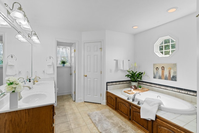 3406 Parks Ln, Spring Hill, TN 37174 - full bathroom featuring double vanity, plenty of natural light, a bath, and tile patterned floors