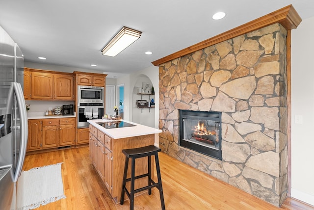 3406 Parks Ln, Spring Hill, TN 37174 - kitchen featuring stainless steel appliances, a kitchen island, light countertops, light wood-style flooring, and recessed lighting