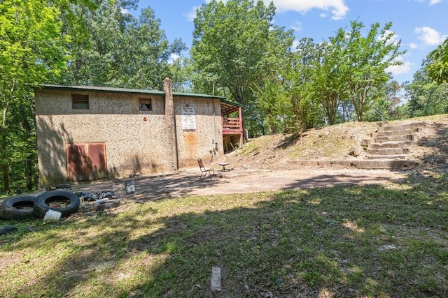 15578 Birdsong Rd, Holladay, TN 38341 - view of green lawn featuring stairs