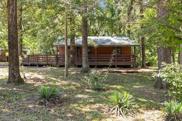 15578 Birdsong Rd, Holladay, TN 38341 - view of yard featuring a deck and a wooded view