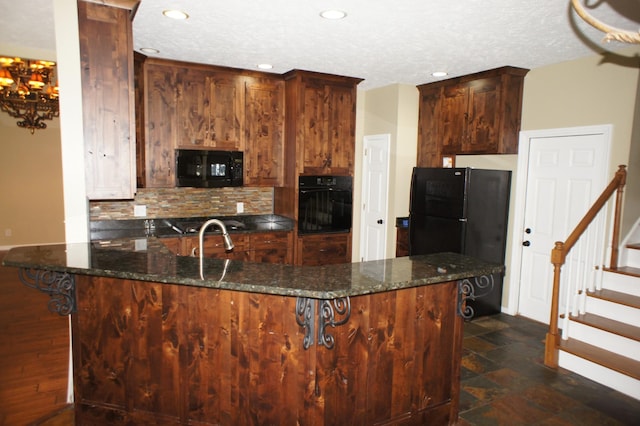 1102 Fairways, Lebanon, TN 37087 - kitchen with black appliances, backsplash, recessed lighting, dark stone counters, and a chandelier