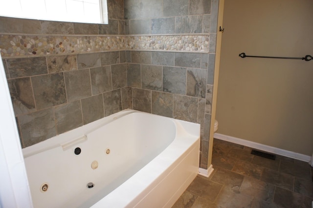 1102 Fairways, Lebanon, TN 37087 - bathroom with a whirlpool tub and stone finish flooring