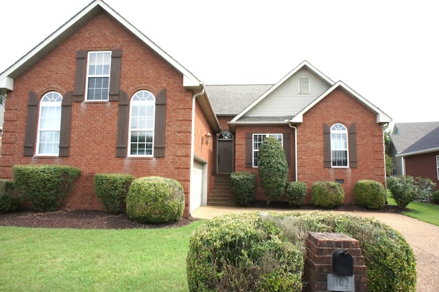 1102 Fairways, Lebanon, TN 37087 - view of front of house featuring brick siding, a front lawn, and a garage