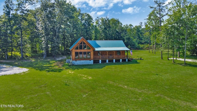 299 Anderson Tinch Ave, Jamestown, TN 38556 - rear view of property featuring covered porch, a lawn, a metal roof, and log exterior