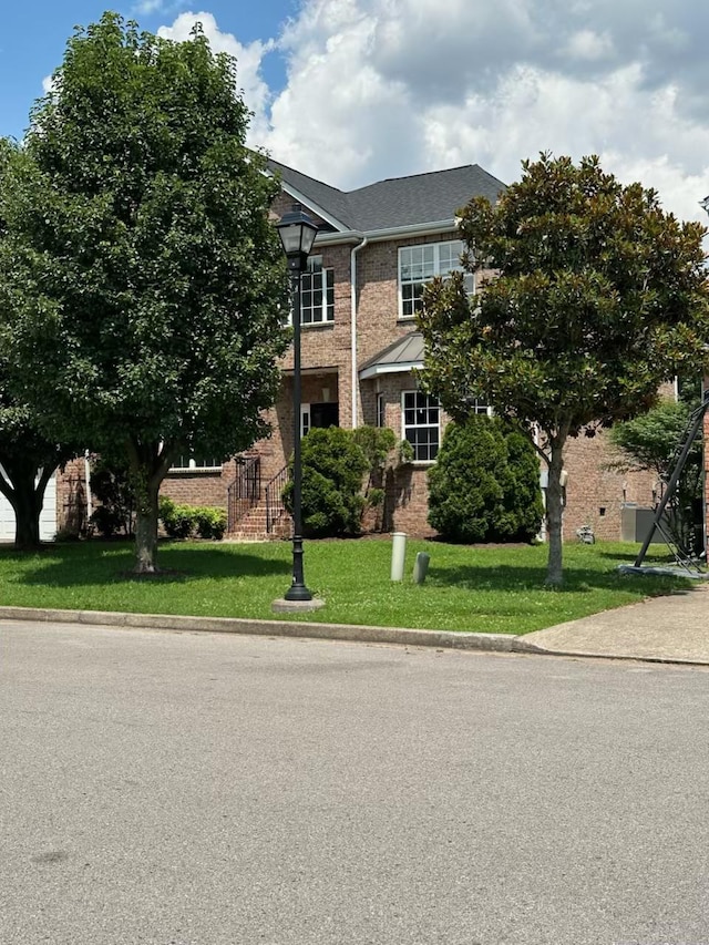 6361 Sunnywood Dr, Antioch, TN 37013 - view of front of home featuring brick siding and a front lawn
