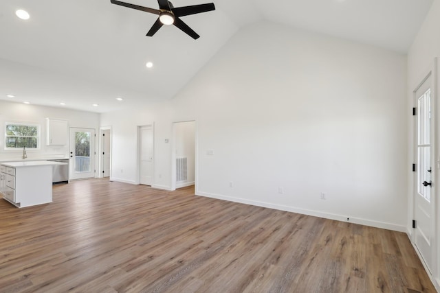 28 Amos Cir, Lafayette, TN 37083 - unfurnished living room featuring ceiling fan, high vaulted ceiling, recessed lighting, and light wood finished floors