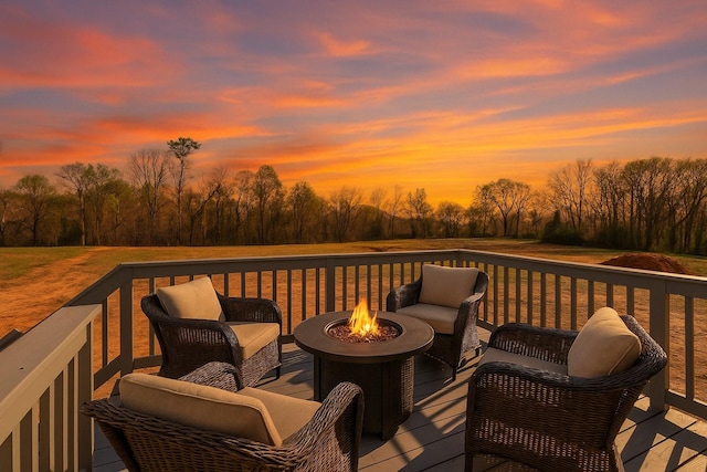 28 Amos Cir, Lafayette, TN 37083 - deck at dusk with an outdoor living space with a fire pit and view of scattered trees