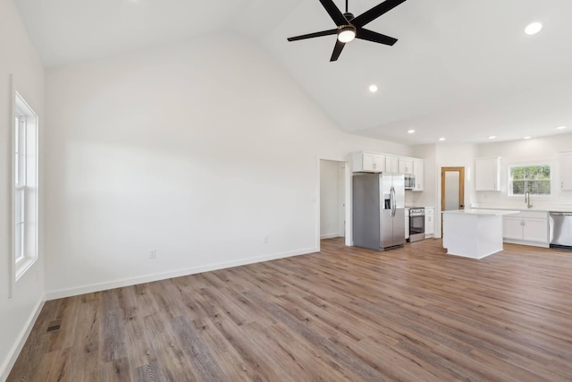 28 Amos Cir, Lafayette, TN 37083 - unfurnished living room featuring a ceiling fan, light wood-style floors, recessed lighting, and high vaulted ceiling