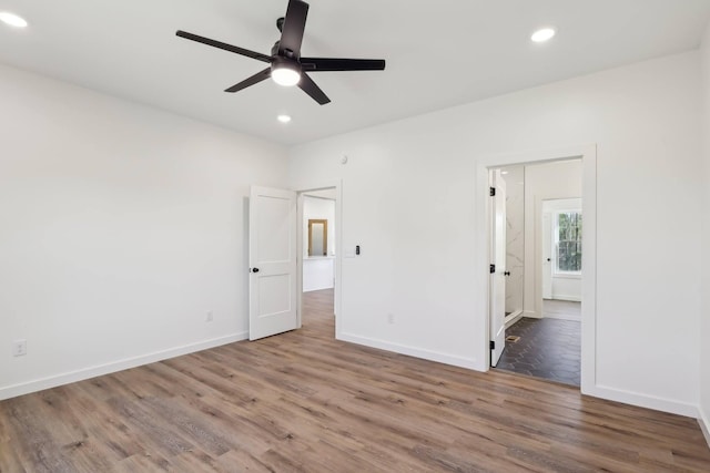 28 Amos Cir, Lafayette, TN 37083 - unfurnished bedroom with wood finished floors, recessed lighting, connected bathroom, and a ceiling fan