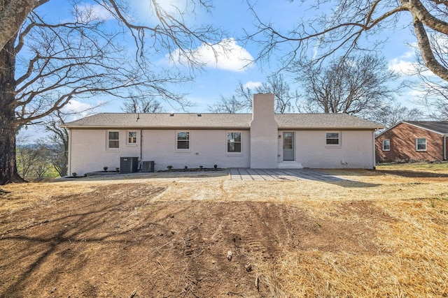 6608 Brookmont Ter, Nashville, TN 37205 - back of house featuring brick siding, a chimney, and a patio