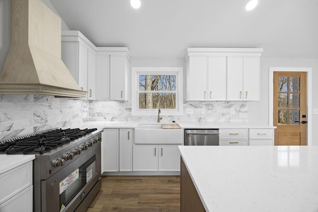 6608 Brookmont Ter, Nashville, TN 37205 - kitchen featuring stainless steel appliances, premium range hood, tasteful backsplash, recessed lighting, and white cabinetry