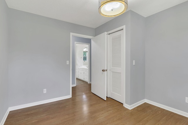 5347 Shady Grove Rd, Morrison, TN 37357 - unfurnished bedroom featuring a closet and wood finished floors