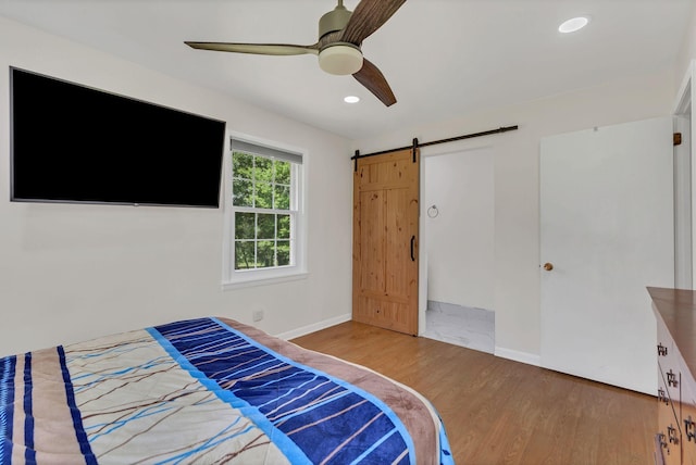 5347 Shady Grove Rd, Morrison, TN 37357 - bedroom featuring wood finished floors, a barn door, recessed lighting, and ceiling fan