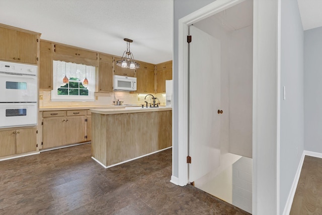 5347 Shady Grove Rd, Morrison, TN 37357 - kitchen with white appliances, light countertops, backsplash, decorative light fixtures, and light brown cabinetry