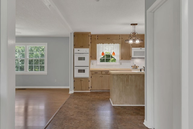 5347 Shady Grove Rd, Morrison, TN 37357 - kitchen featuring white appliances, pendant lighting, decorative backsplash, a textured ceiling, and dark flooring