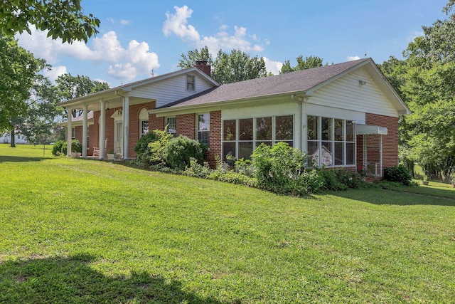 5347 Shady Grove Rd, Morrison, TN 37357 - rear view of house with brick siding, a yard, and a chimney