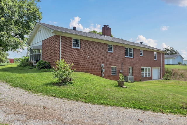 5347 Shady Grove Rd, Morrison, TN 37357 - view of home's exterior featuring brick siding, a chimney, and a yard