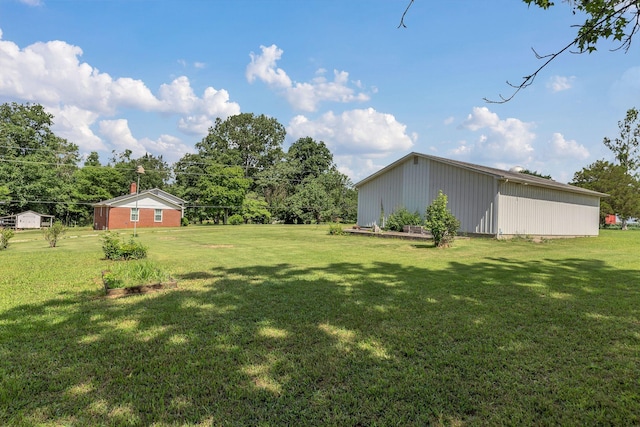 5347 Shady Grove Rd, Morrison, TN 37357 - view of grassy yard featuring an outdoor structure and an outbuilding