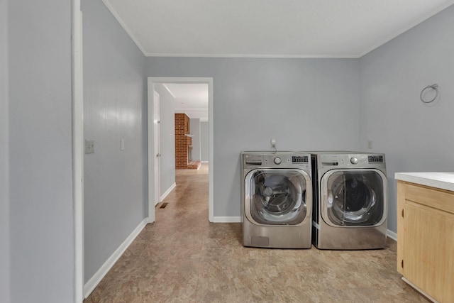 5347 Shady Grove Rd, Morrison, TN 37357 - washroom with washer and clothes dryer and ornamental molding