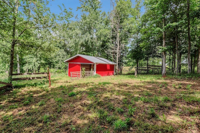 5347 Shady Grove Rd, Morrison, TN 37357 - view of yard featuring a pole building, an outdoor structure, and a wooded view