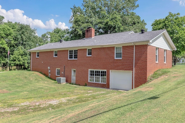 5347 Shady Grove Rd, Morrison, TN 37357 - rear view of property with brick siding, a chimney, a garage, and a lawn
