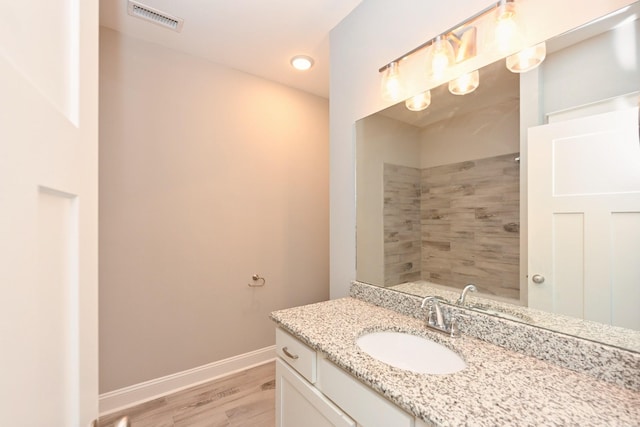 1019 N Maple St Unit 2D, Murfreesboro, TN 37130 - full bath featuring vanity, wood finished floors, and tiled shower