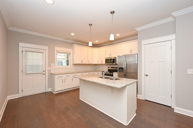 1019 N Maple St Unit 2D, Murfreesboro, TN 37130 - kitchen featuring appliances with stainless steel finishes, white cabinets, ornamental molding, dark wood finished floors, and a kitchen island with sink