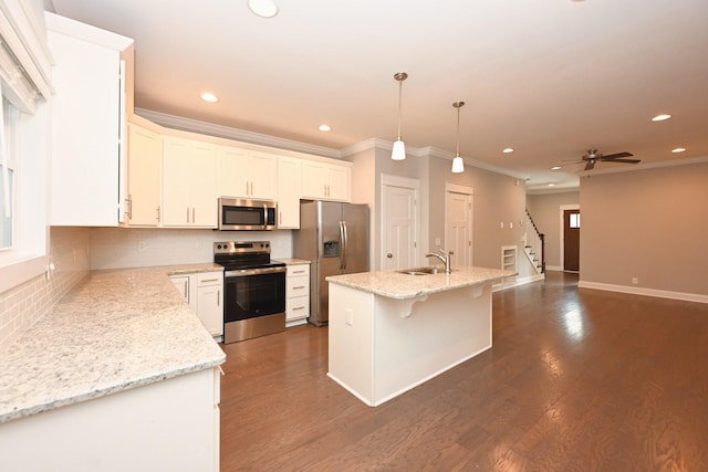 1019 N Maple St Unit 2D, Murfreesboro, TN 37130 - kitchen featuring appliances with stainless steel finishes, ornamental molding, tasteful backsplash, recessed lighting, and white cabinetry