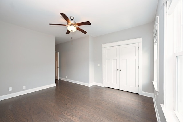 1019 N Maple St Unit 2D, Murfreesboro, TN 37130 - unfurnished bedroom featuring dark wood-style flooring, a closet, and ceiling fan