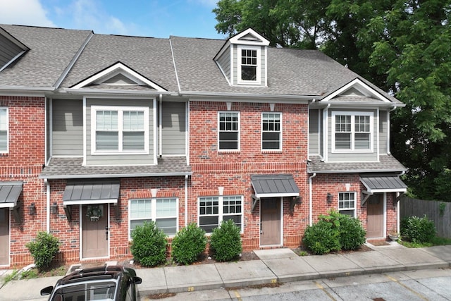 1019 N Maple St Unit 2D, Murfreesboro, TN 37130 - view of property featuring a shingled roof and brick siding