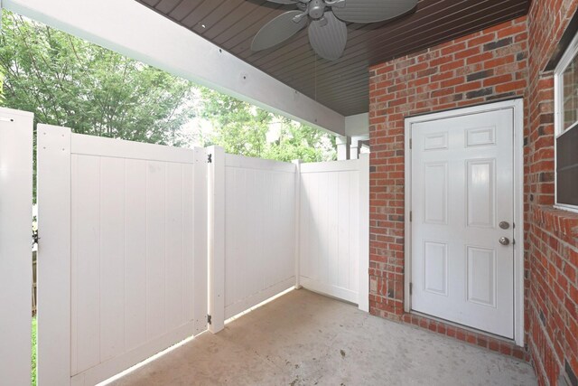 1019 N Maple St Unit 2D, Murfreesboro, TN 37130 - view of exterior entry with brick siding and a ceiling fan