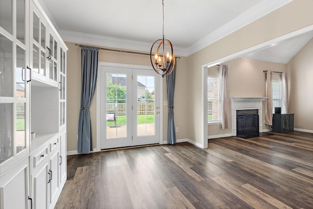 4061 Locerbie Cir, Spring Hill, TN 37174 - unfurnished living room featuring dark wood-style flooring, a chandelier, a fireplace, and crown molding
